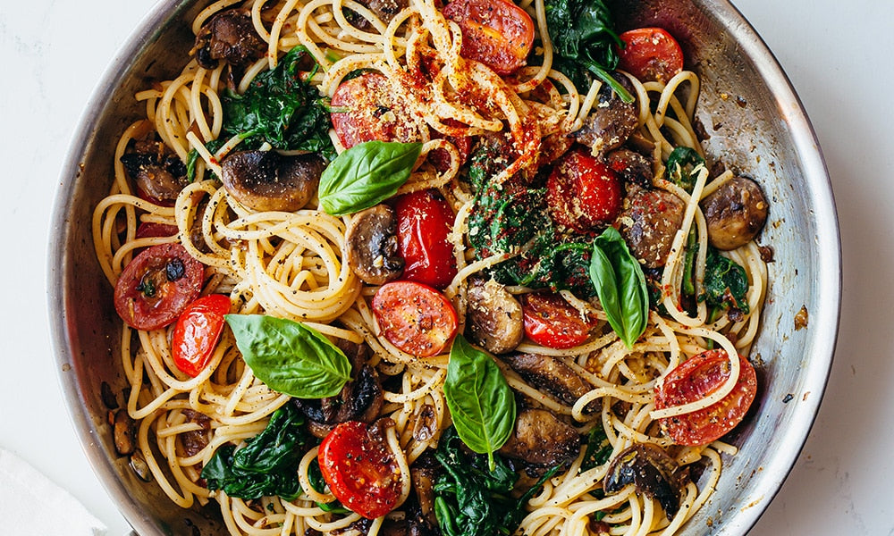 Stir-fried steak and tomatoes over noodles